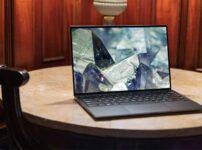 laptop on brown wooden table